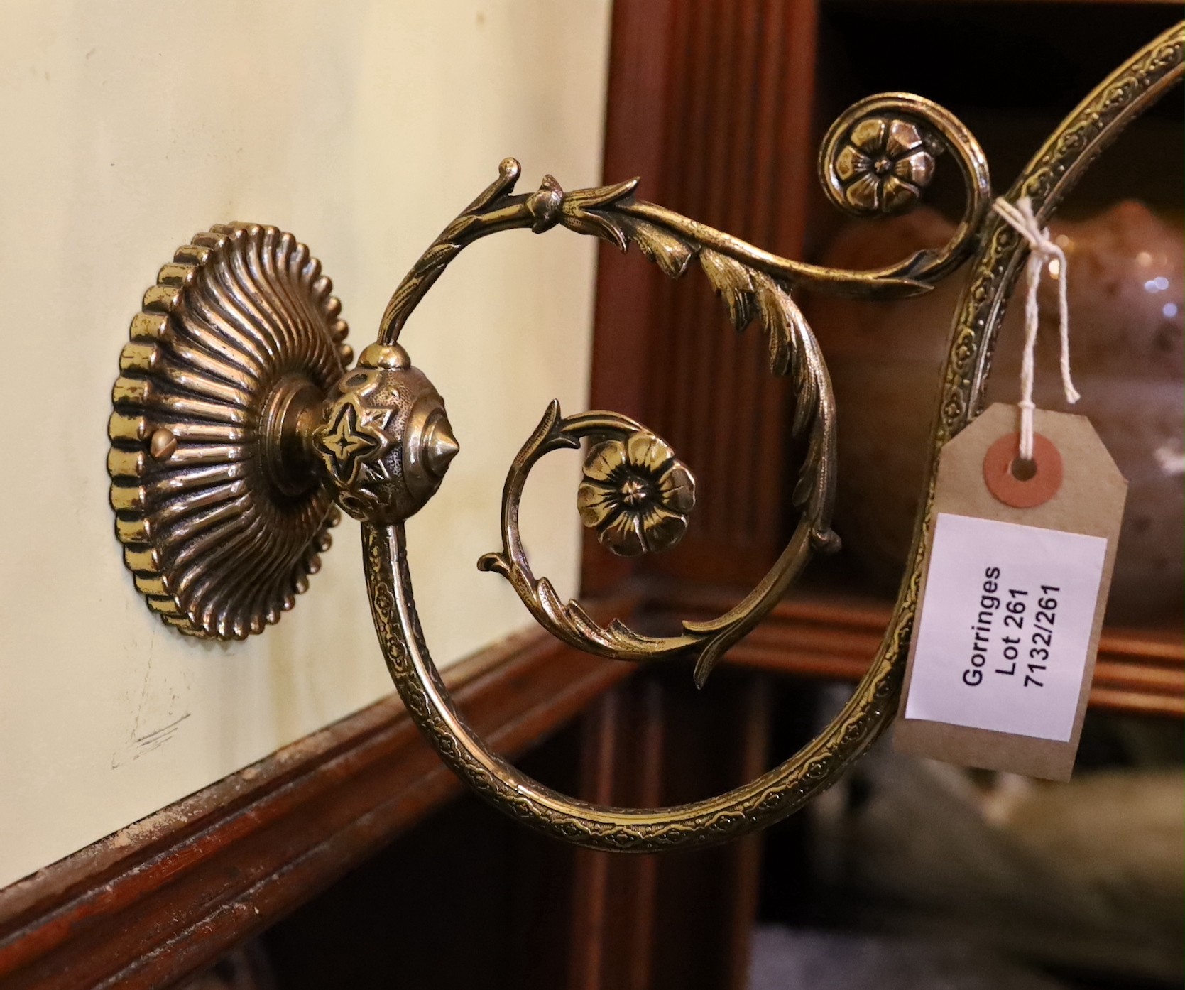 A Victorian brass gasolier wall light with cranberry tinted etched glass shade, now converted to electricity, height 38cm. depth 38cm